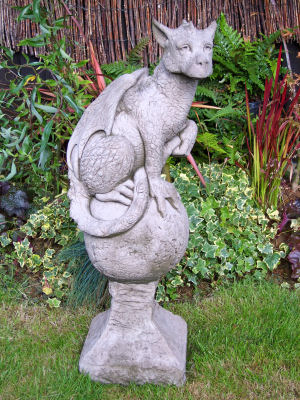 Eryl stone statue-adolescent dragon on a collared ball
